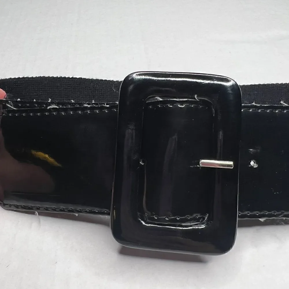 3/$15 or 5/$20 High waisted shiny black belt with elastic back 33”